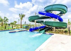 A water park with multiple slides and a pool. - Storey Lake Resort, Private Pool, Near Famous Attractions!! (Kissimmee)
