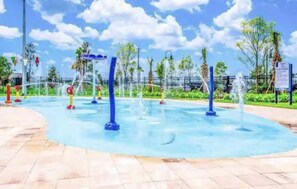 A water feature with multiple fountains and a paved walkway. - Storey Lake Resort, Private Pool, Near Famous Attractions!! (Kissimmee)