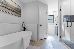 Combined shower/tub, hair dryer, towels, soap