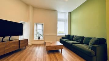Traditional Apartment | Living area | 50-inch Smart TV with digital channels, TV, printers