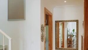 A staircase leading to a landing with a red patterned rug. - AP378 Casa Maria - Burriana (Nerja)