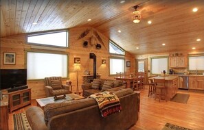 Cabin | Living area | 42-inch plasma TV with satellite channels, TV, fireplace - Fox Den Lodge (West Yellowstone)