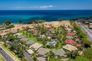 A coastal residential area with houses, a swimming pool, and a road. - Ocean View in KoOlina, HI, minutes from Milo Cove (Kapolei)