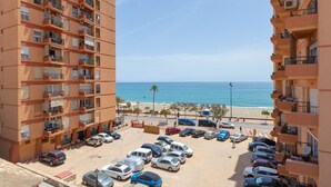 A multi-story parking lot with a view of the beach and ocean. - ATICO CASTILLO - Fantastic apartment with sea views and free WiFi. (Fuengirola)