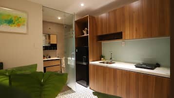 Deluxe Apartment | Private kitchen | Fridge