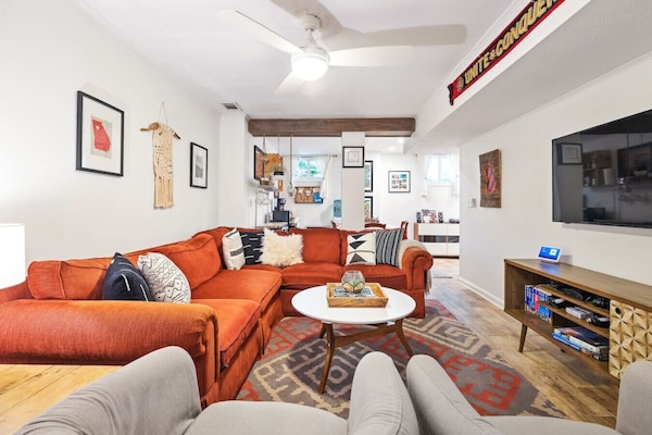 This expansive space offers ample room for relaxation and socializing, while tastefully displayed artwork adds a touch of sophistication and personality.