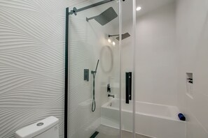 Bathtub, hair dryer, towels, soap