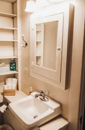 Bathtub, hair dryer, towels, soap