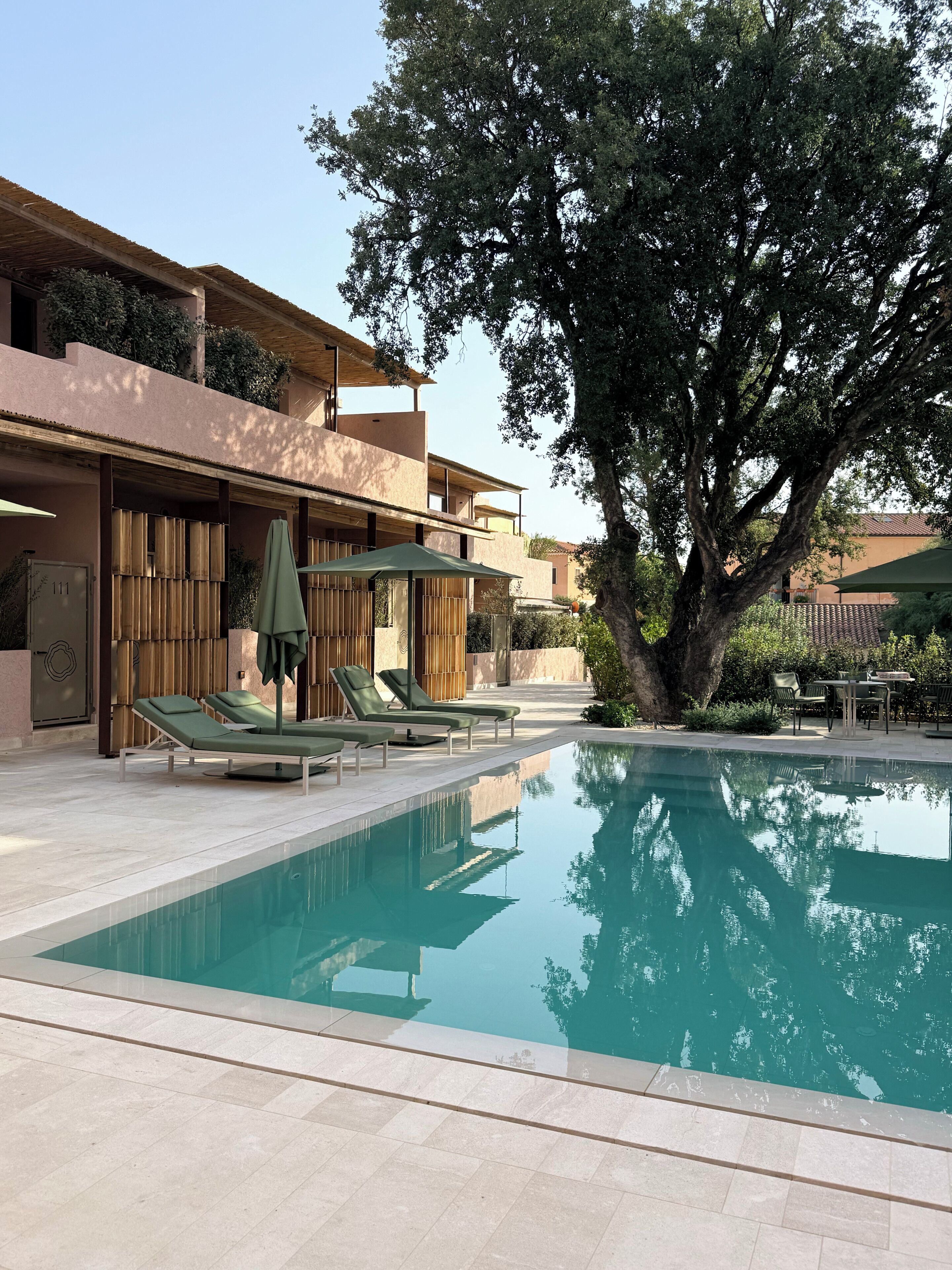 Seasonal outdoor pool, open 8:00 AM to 7:00 PM, pool umbrellas