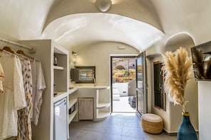Experience a clean and contemporary space with a sink, compact design, and seamless indoor-outdoor connection.