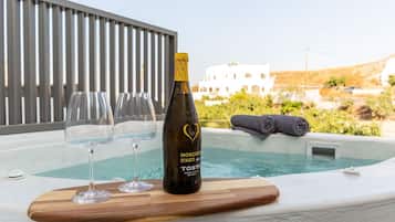 Unwind with a glass of wine in the hot tub, surrounded by serene views.