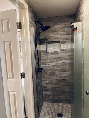 Combined shower/tub, hair dryer, towels, soap