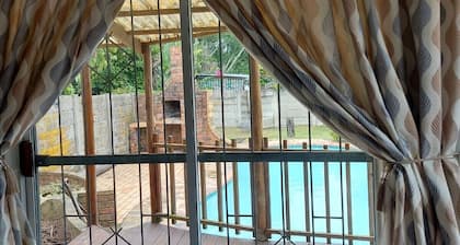 one bedroom cottage fully equipped kitchen lounge and bathroom, free parkin pool
