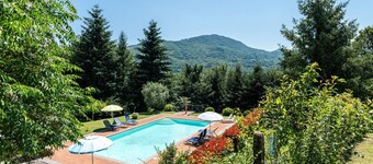 Appartement 'Tramonto al Rifugio Arcobaleno' met uitzicht op de bergen, gedeeld zwembad & Wi-Fi