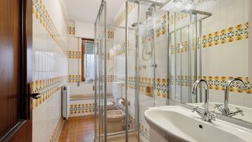 Bathtub, hair dryer, towels