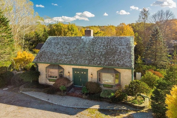 EXTERIOR: Front of the house and driveway (parks up to 6 cars)