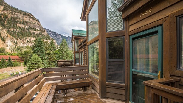 A wooden deck with a view of a mountainous landscape. - Riverwalk Retreat | Private Deck | Walk to Main St (Ouray)