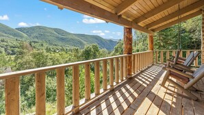 A wooden deck with a railing overlooking a mountainous landscape. - Solitude in Sundance - Hot Tub, 4 Bed 4 Bath, Secluded, Views, Quiet, Forested (Sundance)