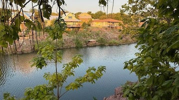 A lake with buildings in the background.