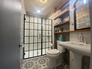 Shower, hair dryer, towels, soap
