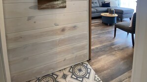 A wooden interior with a beach-themed wall art, a framed picture, and a sign reading "Beach Rules". - Cedar Point, Sports Force, Kalahari Near Cottage. Boat Parking ez Walk to Beach! (Huron)