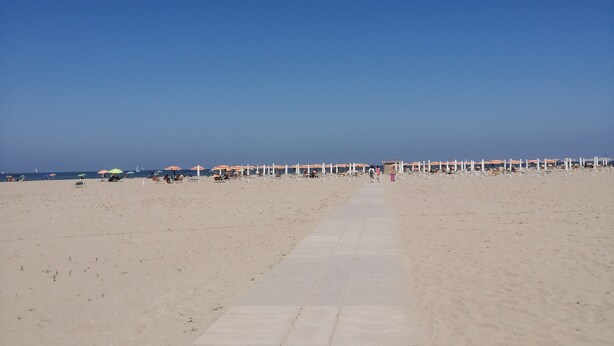 A wide, sandy beach with a clear sky. - Beachfront (Lido di Spina)
