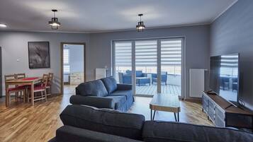 Family Apartment | Living area | 40-inch flat-screen TV with digital channels, TV