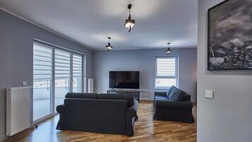 Family Apartment | Living area | 40-inch flat-screen TV with digital channels, TV