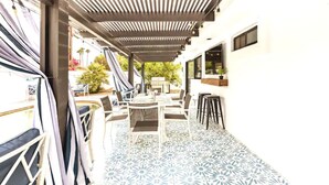 An outdoor patio with a patterned floor, covered seating, and a pergola. -  Desert Escape w/Pool/Jacuzzi (Palm Desert)