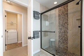 Shower, hair dryer, towels, soap