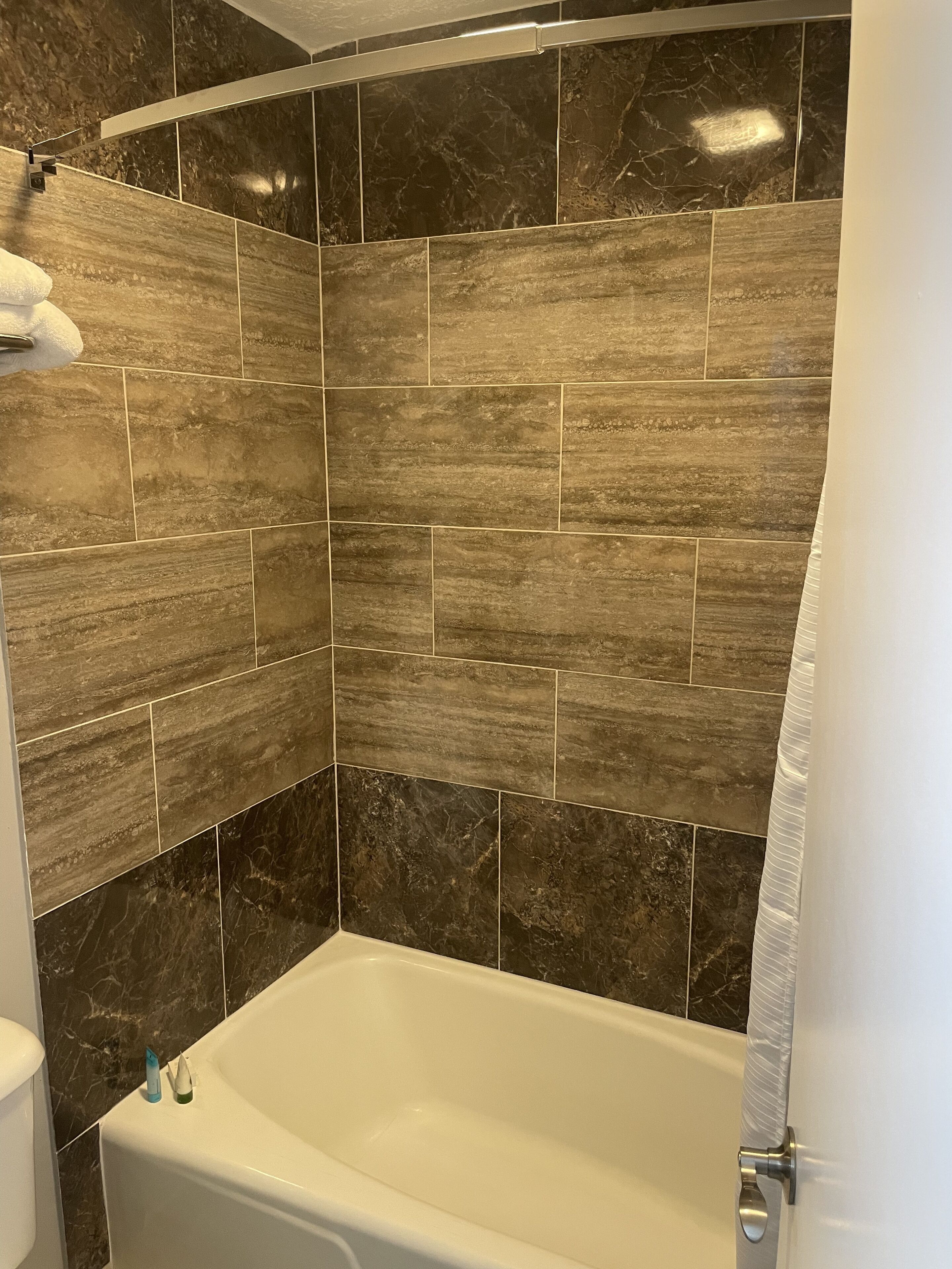 deluxe double room, 1 king bed | bathroom | rainfall showerhead, free toiletries, hair dryer, towels