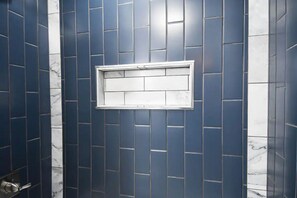 Combined shower/bathtub, hair dryer, towels, toilet paper