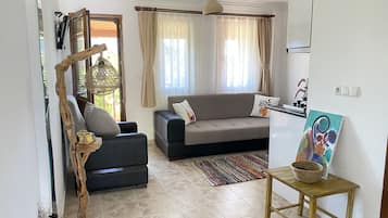 Basic Apartment, 1 Double Bed with Sofa bed, Garden View | Living area | 56-cm LCD TV with satellite channels, TV