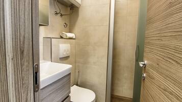 Shower, towels, soap, toilet paper