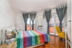 1 bedroom, desk, iron/ironing board, travel crib