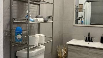 Shower, towels, soap, toilet paper