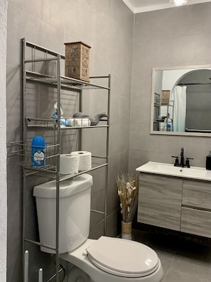 Shower, towels, soap, toilet paper
