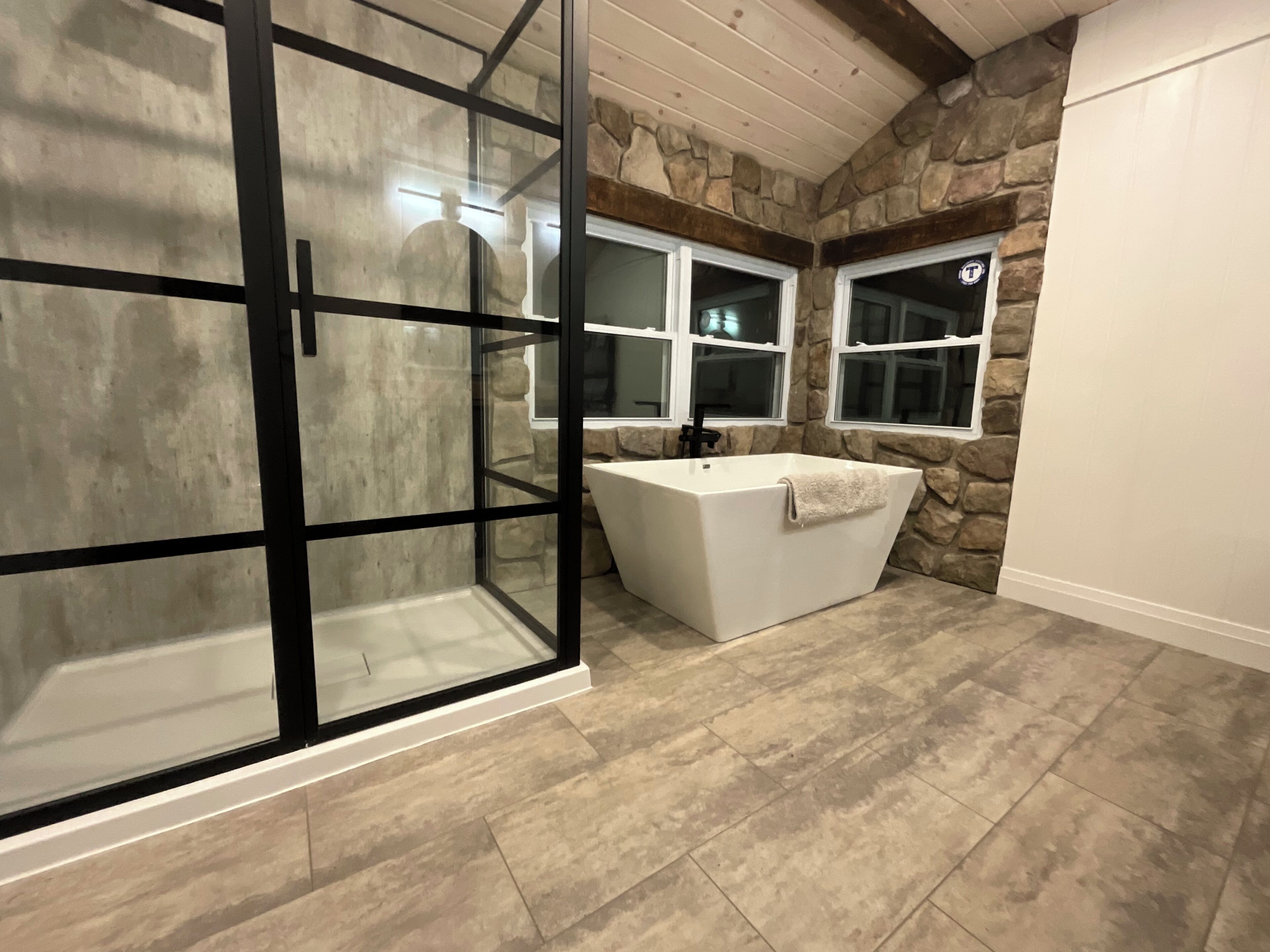 Combined shower/bathtub, hair dryer, towels, toilet paper