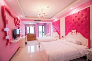 A pink-themed hotel room with two beds, a TV, and a desk. - JIAN GE SHI GUANG TRAVEL HOTEL(Zhangjiajie Tianmenshan Cableway Station) (Zhangjiajie)