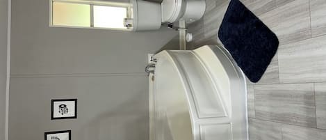 Combined shower/tub, hair dryer, towels, soap