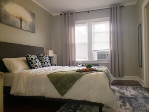 1 bedroom, desk, iron/ironing board, travel crib