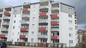 A multi-story residential building with balconies, a flat roof, and a paved ground floor. - Carpe Diem Frankenthal Palatinate Wine Route Kurpfalz (Frankenthal)