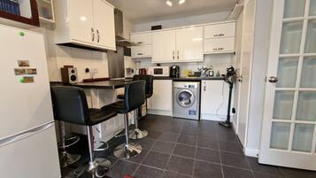 Apartment, 1 Queen Bed with Sofa bed | Private kitchen | Fridge, microwave, oven, stovetop