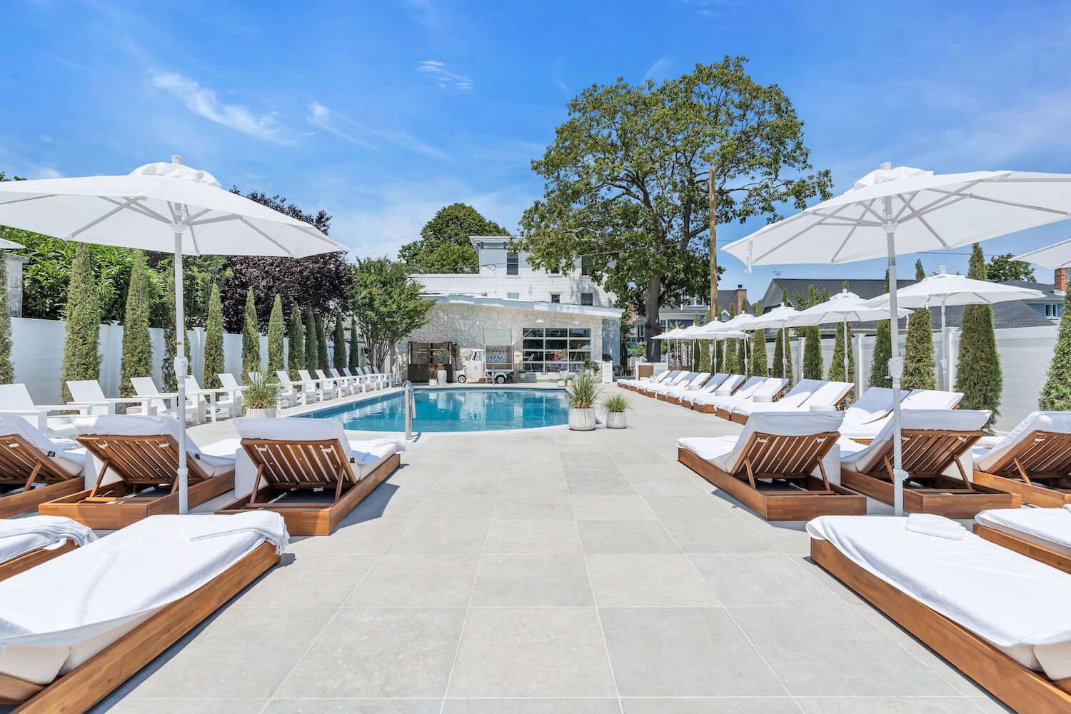 Seasonal outdoor pool, open 10:00 AM to 5:00 PM, pool umbrellas