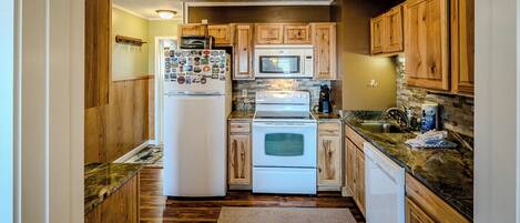 Microwave, coffee/tea maker, toaster, cookware/dishes/utensils