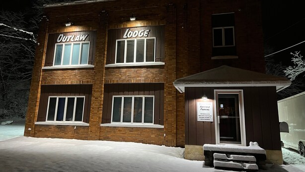 A brick building with signs reading "OUTLAW" and "LODE" at the top. - Outlaw Lodge (Hatfield 1st Floor) ATV,SXS Offroad (Iaeger)