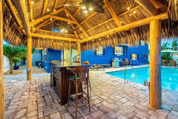 Outdoor pool, a heated pool - TIKI BLUE Beach House:Heated Pool+Hot Tub+Tiki Bar (Cocoa Beach)