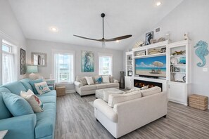 Smart TV, fireplace, books, stereo