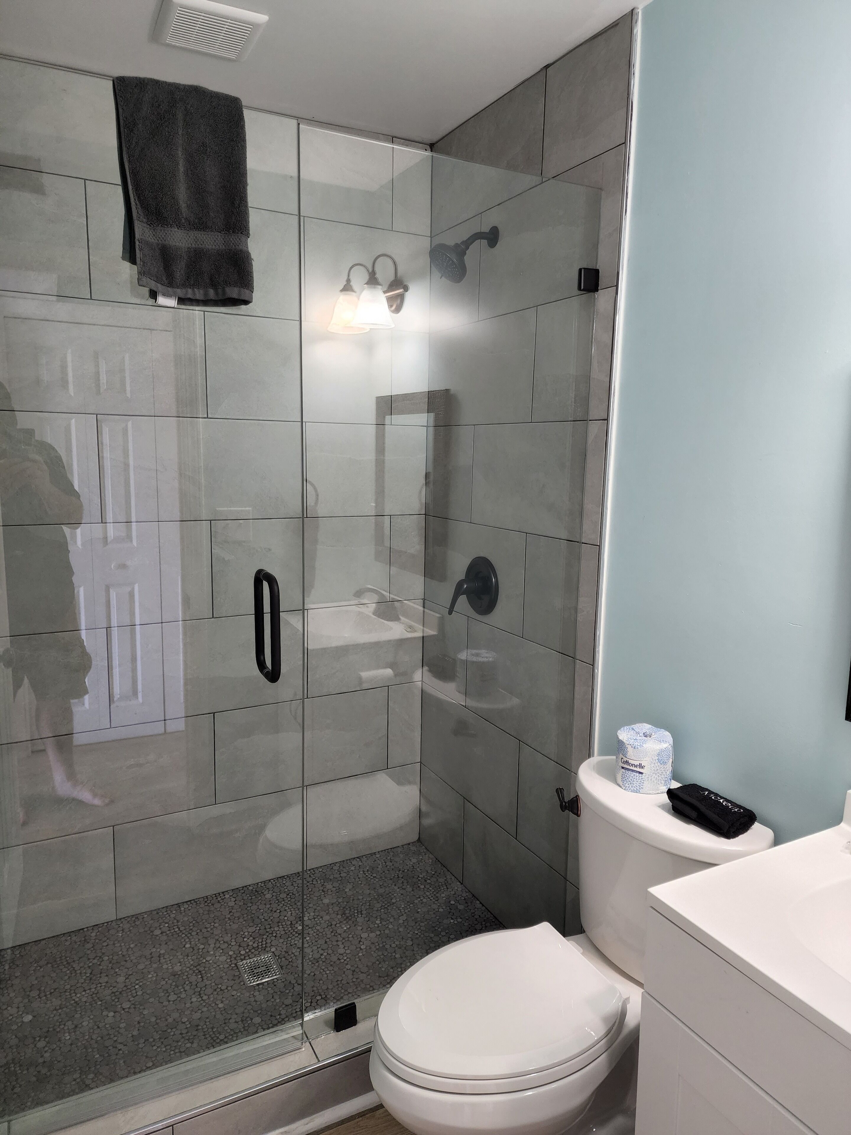 Shower, hair dryer, towels, soap