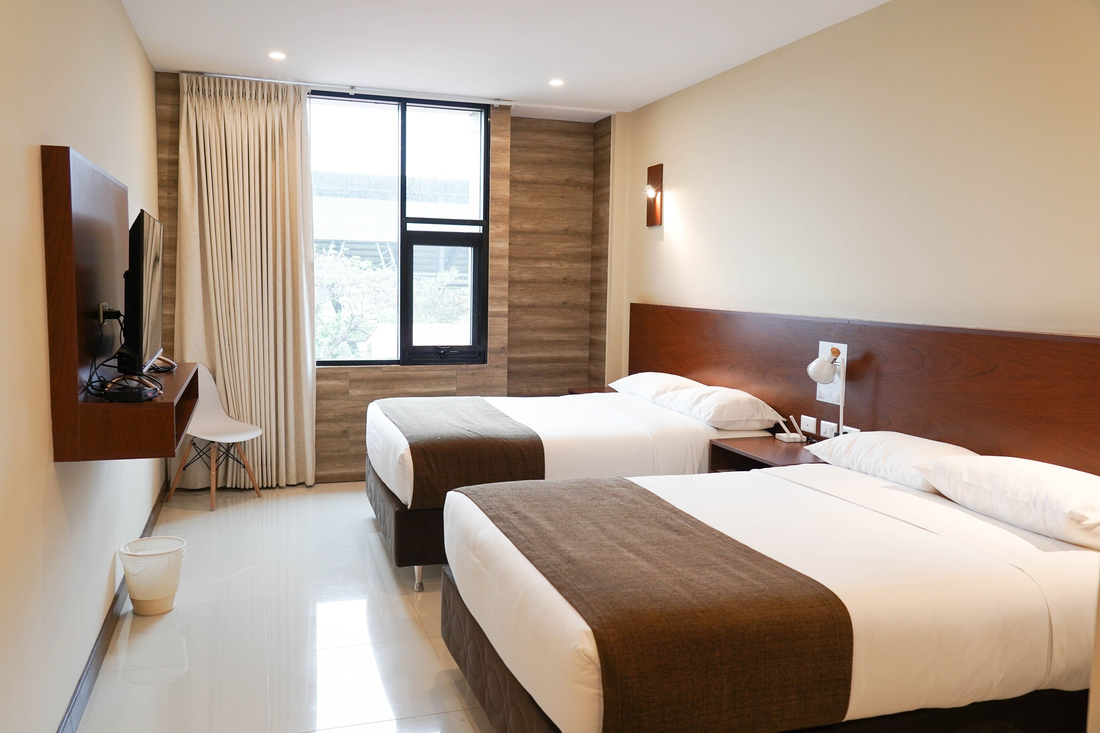 Premium bedding, down comforters, in-room safe, desk